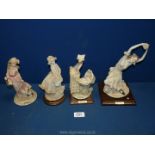 A Belcari figurines including ballerina, a girl with baby in pram,