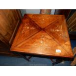 A good Edwardian Mahogany and Rosewood Envelope Table,