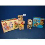 A boxed clockwork knitting bear made in Western Germany,