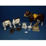 A small quantity of animal ornaments including a pair of bulldogs, two heredities figures,