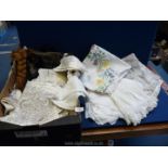 A large quantity of linen and lace (some embroidered) to include; tablecloths, napkins, etc.