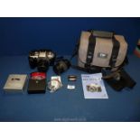 A Canon EOS 50E 35mm Camera with 50mm lens, instruction manual, 28-80mm zoom lens,