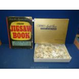 A 'Welcome' jigsaw puzzle book 'Epics of War' containing four puzzles together with a Victory Gold