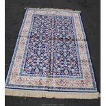 A modern blue and gold floral Persian style Rug,