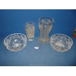 A Royal Doulton cut glass bowl, a large star design vase and two other pieces.