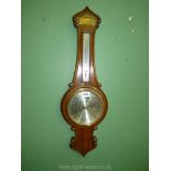 A banjo Barometer by Comitti of London; presented to E.J.