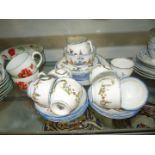 A Royal Doulton Dainty Dinah Teaset including cake plate, seven cups, seven saucers,