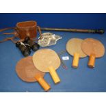 A vintage table tennis set including four bats, net and a support for net,