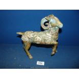 A brass model of a Goat with ornate raised decoration, 9" x 9".