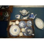 A large quantity of blue and white china including Willow pattern cups and saucers and side plates,
