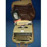 A soft case travel Olivetti 'Lettera 22' typewriter with manual.