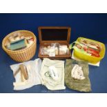 A quantity of sewing items including; cotton reels, buttons, safety pins, needles, etc.