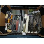 A box of 'OO' gauge train track and various carriages, some Tri-ang, various carts including; coal,