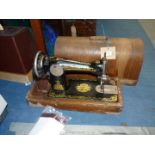 A cased hand Singer sewing machine, Y927693, case a/f.