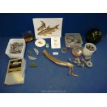 A small quantity of fishing items to include; lead fishing weights, fish hooks, fishing float,