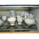 A Wawel blue and pink floral Teaset including six cups, saucers, tea plates, milk jug, sugar bowl,