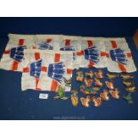 A quantity of embroidered animal patches and a silk bunting decorated with a blue crown.