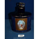 A Limoges Castel France, 22k gold blue and gilt decanter with classical scene to front, 8" tall.