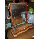 A circa 1900 Mahogany serpentine fronted based and framed swing mirror,