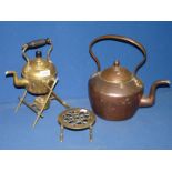A small quantity of brass items including brass kettle on stand, trivet and copper kettle.