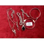 Three silver chains and a pendant with black cabuchon, silver bangles etc.