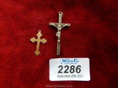 A 9ct gold cross pendant plus one other white metal cross.