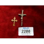 A 9ct gold cross pendant plus one other white metal cross.