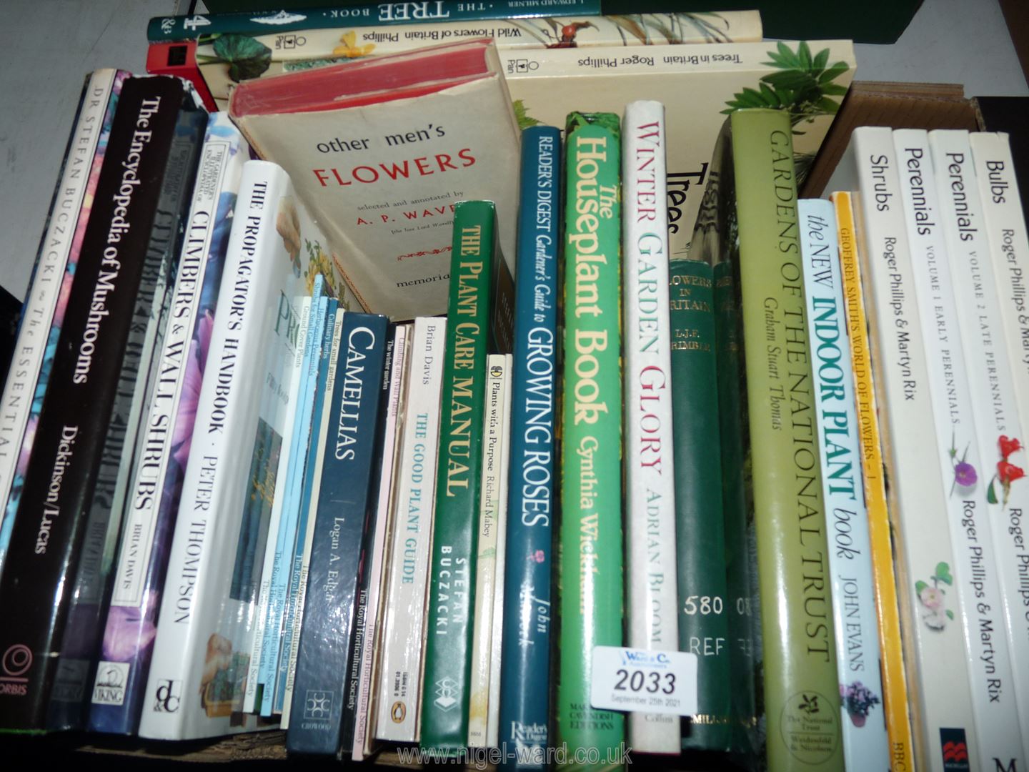 A box of gardening books.