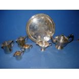 A Sheffield plate teapot and milk jug and an EPNS plated hot water pot,