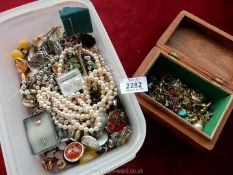 A tub of mixed jewellery including clip-on earrings,
