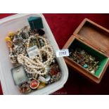 A tub of mixed jewellery including clip-on earrings,