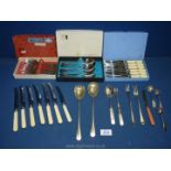 A quantity of various cutlery including boxed Sheffield stainless steel forks, box set of spoons,