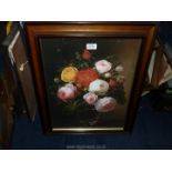 A large wooden framed Print depicting a still life of flowers in a glass vase,