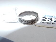 A ring marked "Silver" decorated with trailing Ivy in relief, inside diameter 17.5 mm approx.