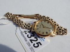 A "Seiko" lady's wristlet watch having a 9 carat gold gate-style bracelet,
