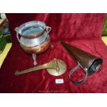 A copper ale muller, a copper pot and a brass pot bracket for a range cooker.