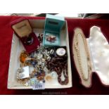 A quantity of costume jewellery to include; brooches, clip on earrings, embroidered scarf ring, etc.
