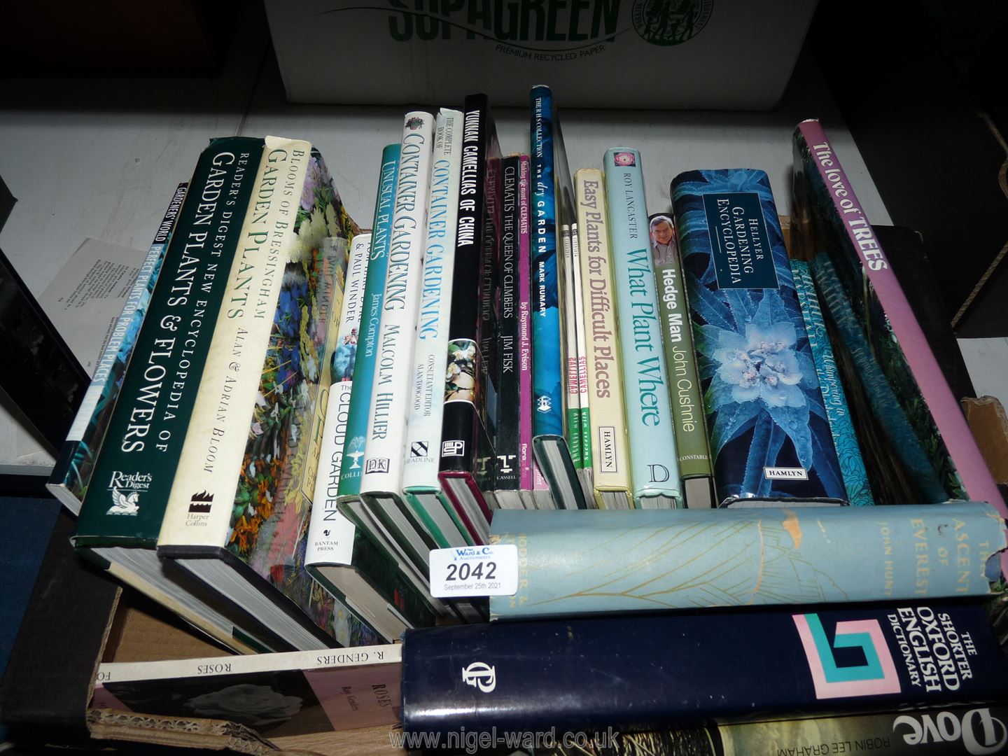 A box of gardening books.