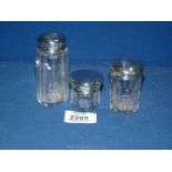 Two London silver and glass top dressing table bottles and a Birmingham silver top bottle (well