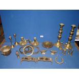 A small quantity of brass to include; candlesticks, chamber sticks, two small anvils,