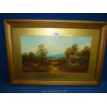 A framed and mounted oil painting of a country scene with trees and a thatched cottage.