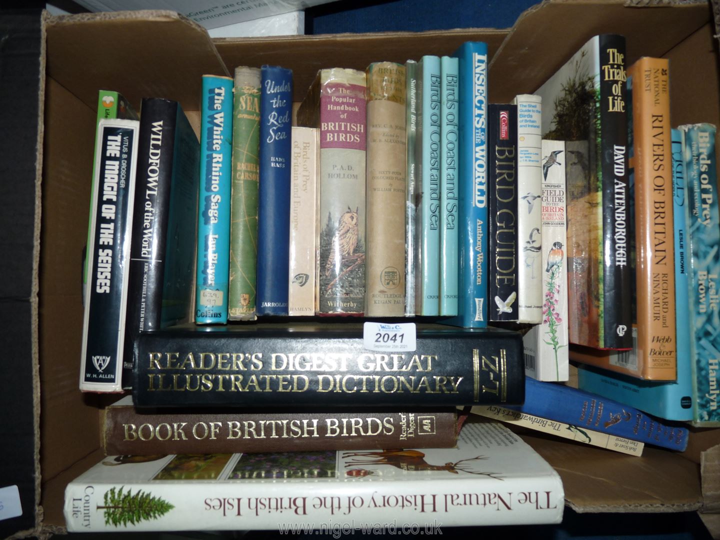 A box of books on birds, insects, wild fowl, etc.