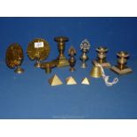 A small quantity of brass including; a pair of peacocks, pair of candlesticks, a bell,