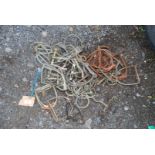 Quantity of old stirrups and horse bits.