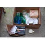 Three boxes of drinking glasses, crockery and DVD's.