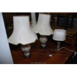 Three table lamps.