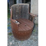 A tub chair made from recycled whisky barrel.