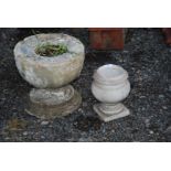 A small marble urn and concrete planter/base.