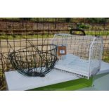 Metal pet carrier and garden baskets.