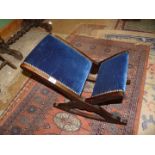 A Gout Stool with blue velvet and stud upholstery.